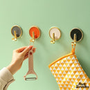 Crochet adhésif porte serviette